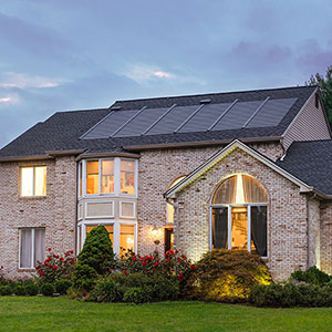 Front view of a home with GAF's Timberline Solar shingles on its roof