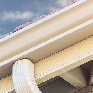 Close up of a seamless gutter system on a home